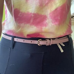 thin purple leather belt (probably fake leather)